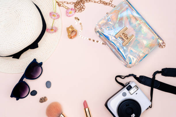 istock summer travel accessories. camera, hat, glasses and top view on a light background. with space for your text 1358915065