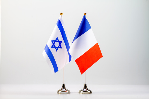 State flags of Israel and France on a light background.