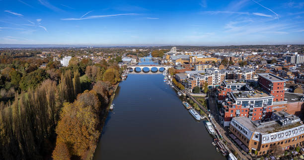The drone aerial panoramic view of River Thames runs through the Royal Borough of Kingston upon Thames and the London Borough of Richmond upon Thames. The drone aerial panoramic view of River Thames runs through the Royal Borough of Kingston upon Thames and the London Borough of Richmond upon Thames. hampton court palace stock pictures, royalty-free photos & images