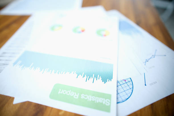 A statistical report with a diagram lies on the table, close-up, blurry. Monitoring of the assessment of indicators, annual reporting