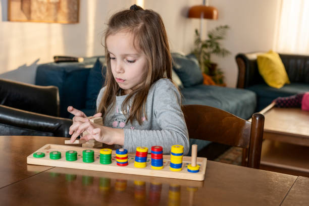 istock Child playing with mathematical toy 1358925922