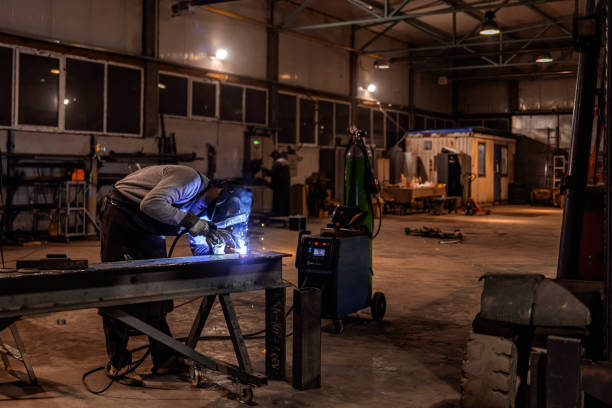 istock Factory worker grinding a metal. 1358926502