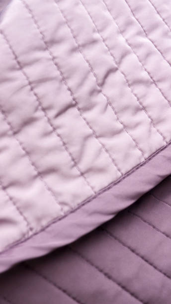 istock Shiny purple striped bed cover 1358926515
