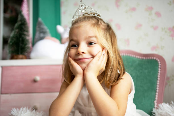 istock Girl wearing tiara 1358927479