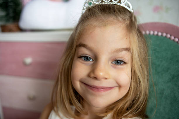 istock Girl wearing tiara 1358927488