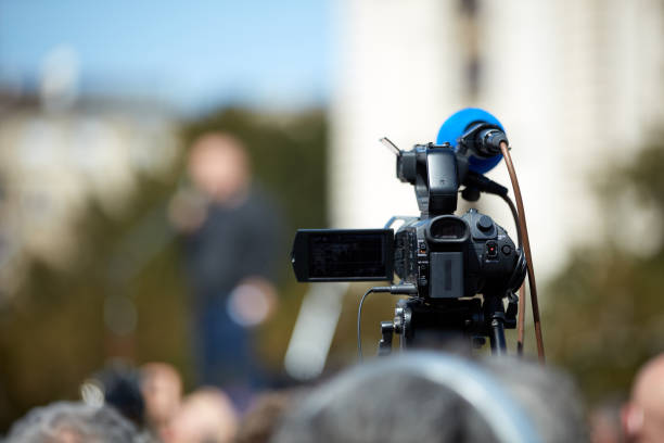 istock News broadcasting and recording protest on the streets. 1358927944