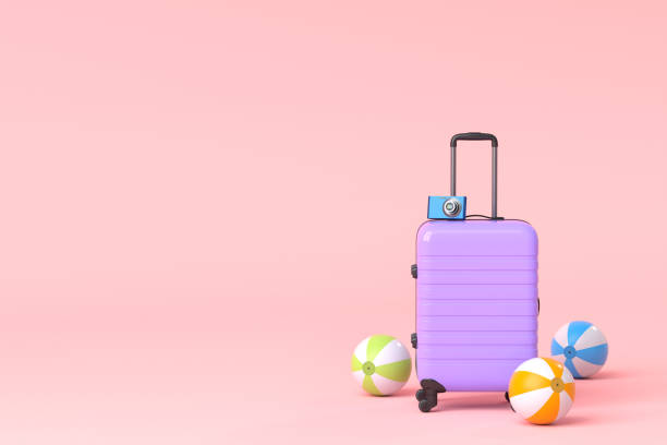 istock Colorful suitcase or baggage with beach accessories on pink background. 1358928668