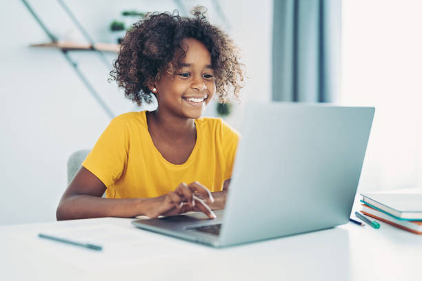 istock Schoolgirl during online class 1358928970