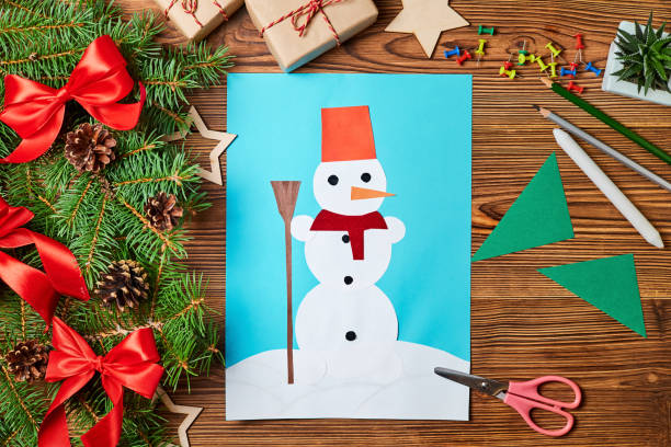 istock A Christmas greeting card from colored paper made by a child 1358929321