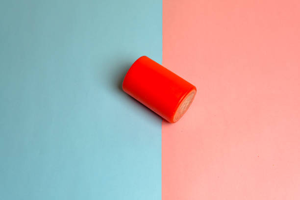 istock black red candle closeup studio photo on pink blue background 1358931727