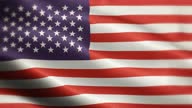 istock National Flag of United States Animation Stock Video - American Flag Waving in Loop and Textured 3d Rendered Background - Highly Detailed Fabric Pattern and Loopable - United States of America, USA, The US, The USA Flag 1358931820