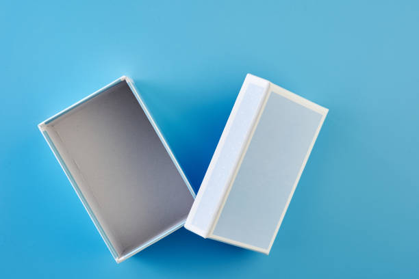 istock blue paper gift box against blue background 1358933048