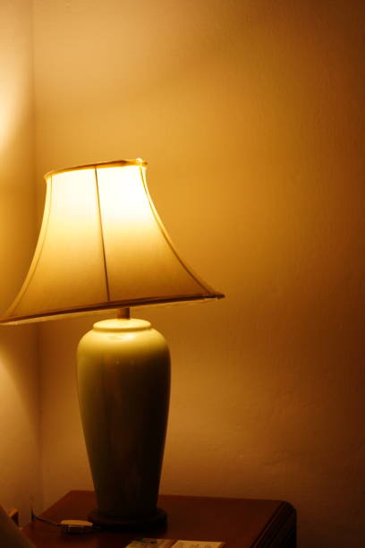 istock Classic lamp on wooden table 1358933853