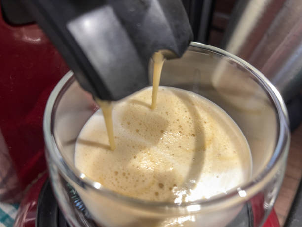istock Coffee in preparation from a coffee machine. 1358935300