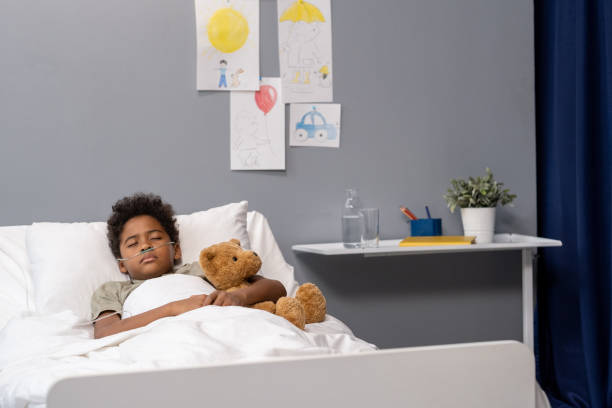 istock Little patient sleeping at hospital ward 1358938838