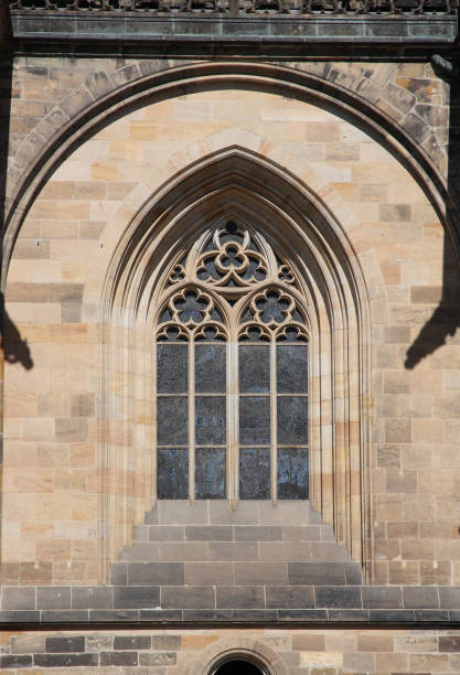 istock Gothic style window on the wall of an old temple. 1358940360