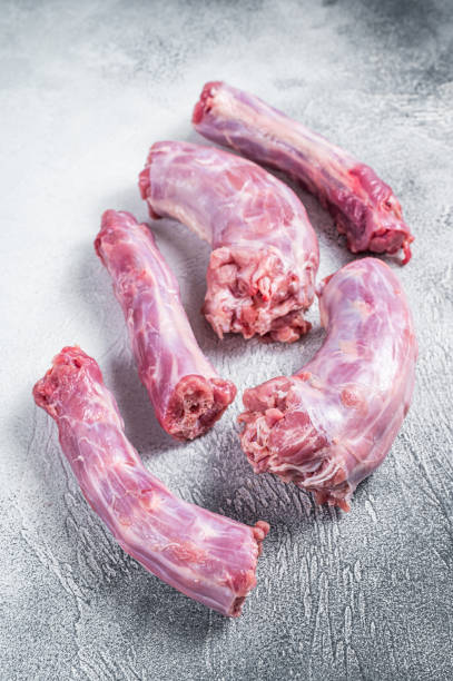 istock Raw Turkey neck meat on a butcher table. White background. Top View 1358942627