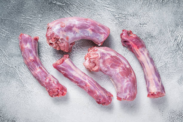 istock Raw Turkey neck meat on a butcher table. White background. Top View 1358942632