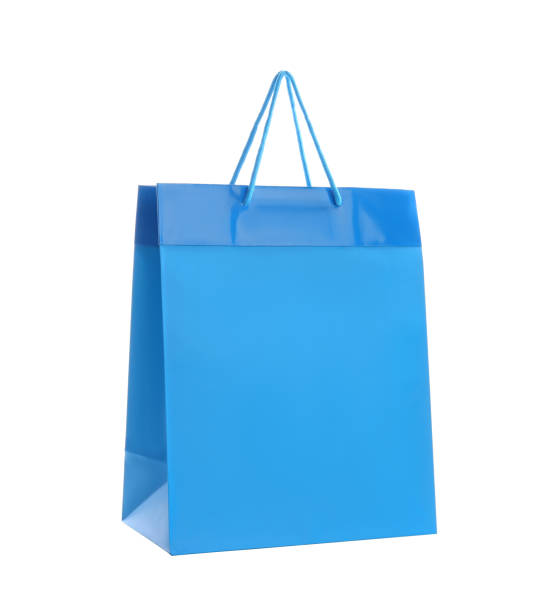 istock Blue paper shopping bag isolated on white 1358944154