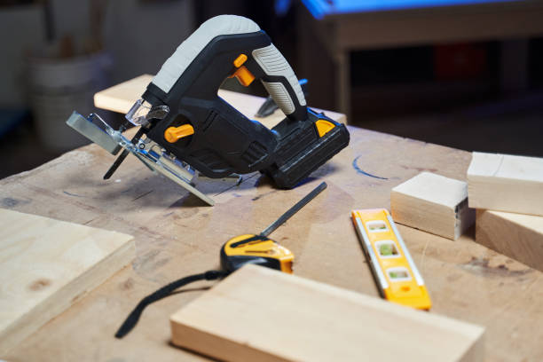 istock a jigsaw with a battery lies on a workbench next to a tape measure and a level meter 1358944324