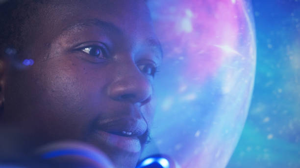 istock Looking for New Earth. African ethnicity man exploring Space, travelling through bright cosmic dust 1358947925
