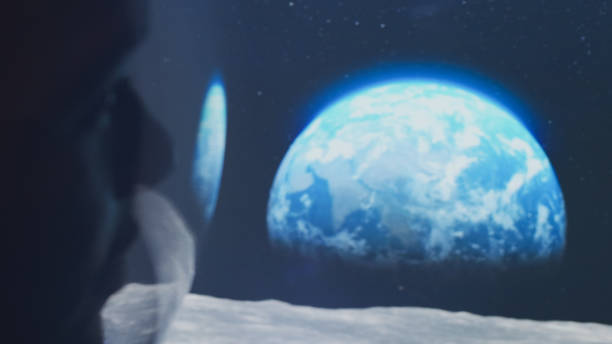 Young man looking at breathtaking view. Space reflecting in helmet visor. Close up on eyes