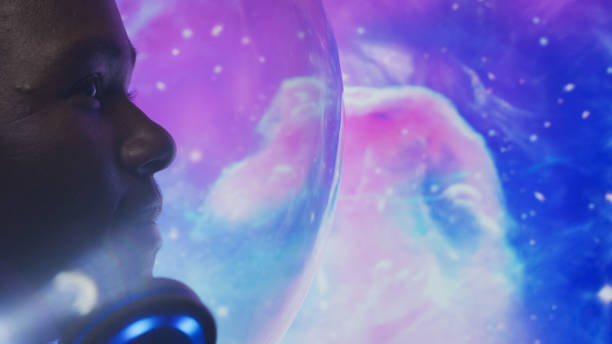 istock Looking for New Earth. African ethnicity man exploring Space. Moon surface reflections 1358948006