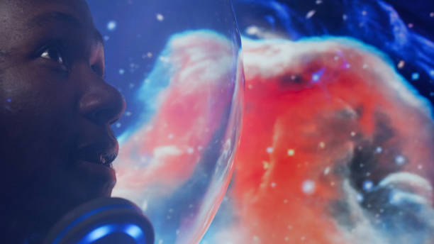 istock Looking for New Earth. African ethnicity man exploring Space. Moon surface reflections 1358948016