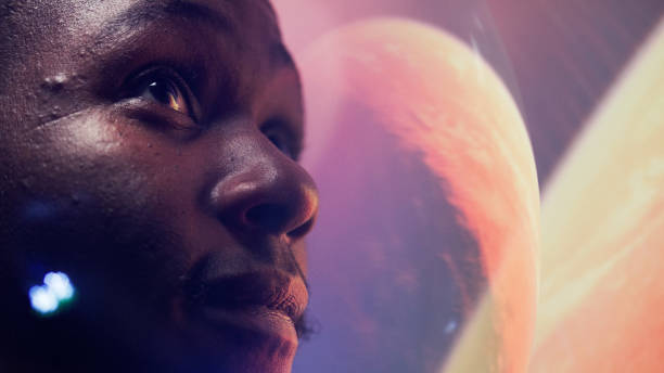 istock Looking for New Earth. African ethnicity man exploring Space. Moon surface reflections 1358948079