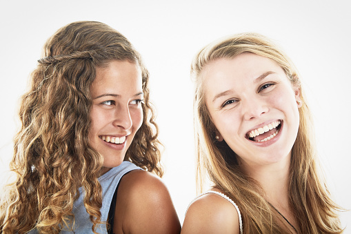 Young woman and teenage girl are very happy to be together.