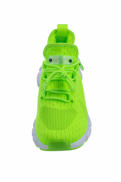 istock Green sneaker made of fabric on a white background 1358949907