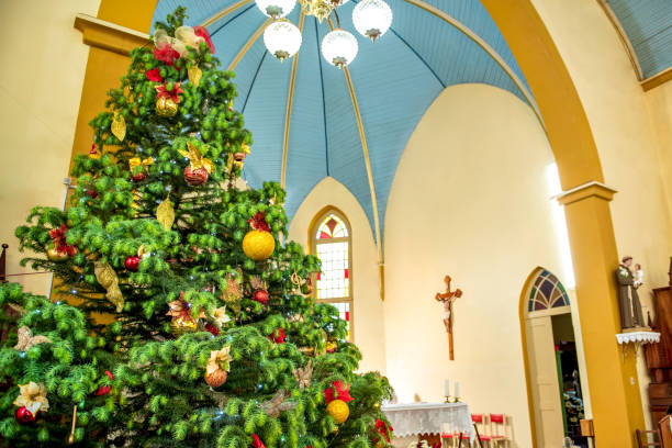 istock Christmas tree decorated inside a church 1358949910