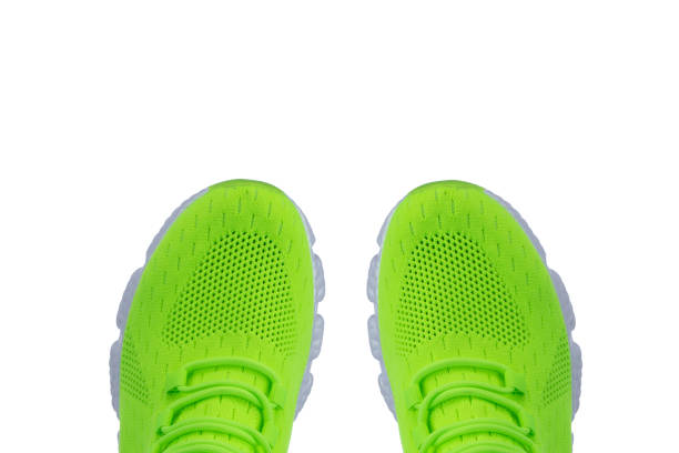istock Green sneaker made of fabric on a white background 1358949914