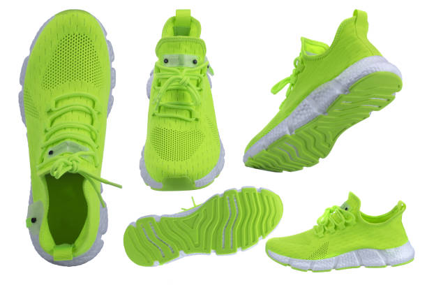Several green sneakers on a white background.