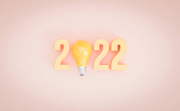 istock Yellow lightbulb among number for 2022 creative thinking idea for start new year on yellow background by 3d rendering. 1358950885