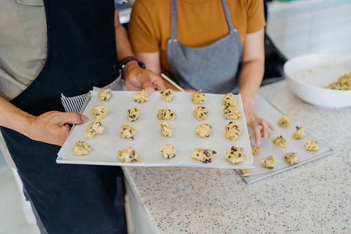 Image of an Asian Chinese couple making cookie dough and prepare for cookie baking