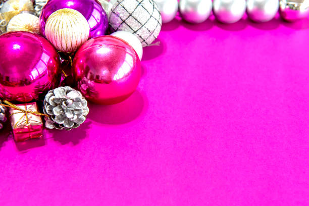 istock Christmas balls and ornaments on a pink background 1358951388