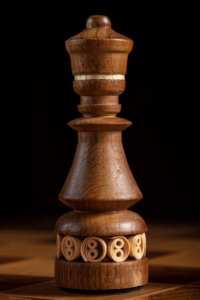 istock Chess king on a black background. A puzzle game with tricky combinations that requires planning and thinking. 1358952358