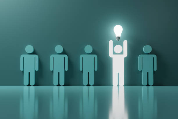 istock Glowing human hand rise up with lightbulb among normal blue human icons for creative thinking idea and smart problem solving solution concept by 3d rendering. 1358953292