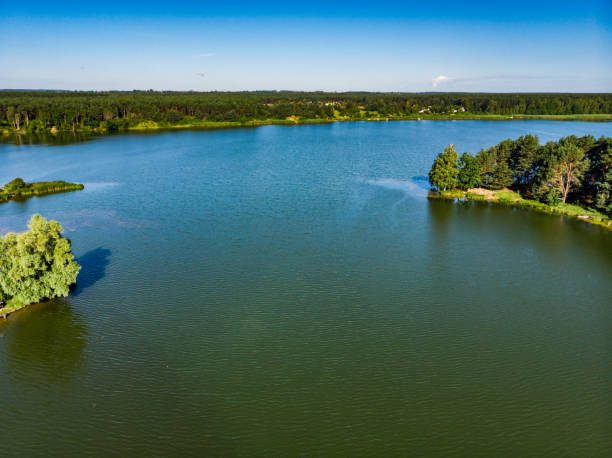 Lake in Tuchola Forests, Poland. Aerial view Aerial view. Lake and green forest in Tuchola national park, Poland. Summer landscape in Europe. bory tucholskie stock pictures, royalty-free photos & images