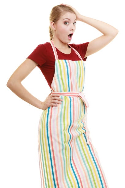 istock Funny housewife in kitchen apron 1358955086