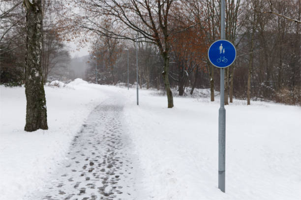 istock Winter image of a pedestrian and cycle path covered with snow 1358955270