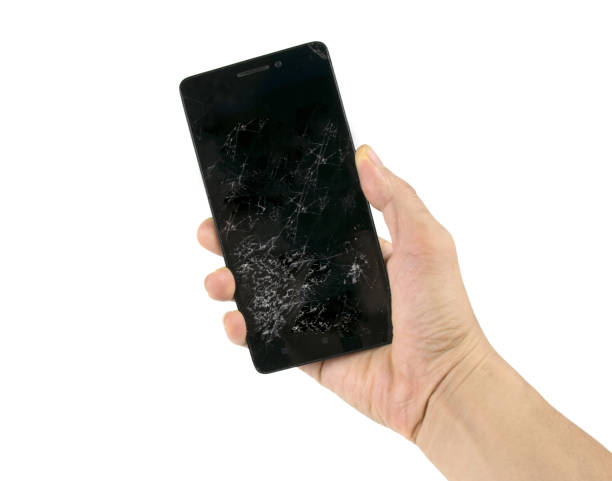 istock Black smartphone or mobile phone screen cracked,fractured or broken isolated on white background with clipping path. 1358957543