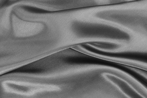 istock Grey fabric cloth texture for background and design art work, beautiful crumpled pattern of silk or linen. 1358957792