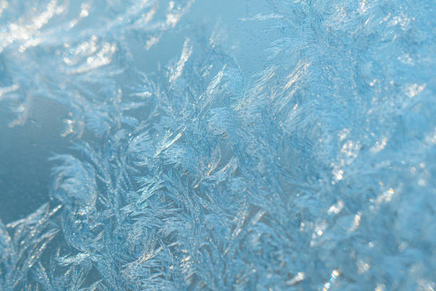 istock A beautiful fabulous winter patterns on a frozen window 1358958994