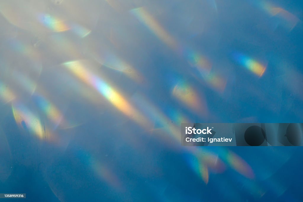 Blue color light effect background with a small glares Prism Stock Photo