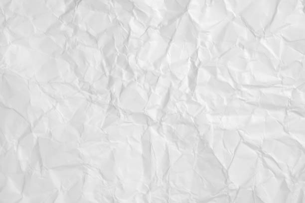 istock White crumpled paper texture abstract background for backdrop or wallpaper. 1358960613