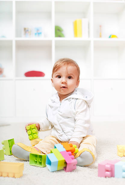 istock Cute little baby playing with colorful blocks 135896065