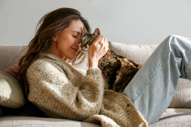 istock Young woman and her cat 1358961432
