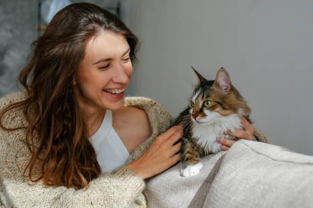 istock Young woman and her cat 1358961439